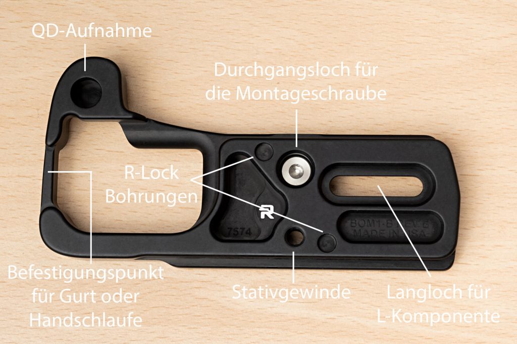 RRS OM-1 Bodenplatte (BOM1-B): Ausstattungsfeatures auf der Unterseite (u.a. QD-Aufnahme, Stativgewinde, R-Lock Bohrungen und Befestigungspunkt für Gurt oder Handschlaufe)